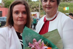 Triona Bonner (left) making a presentation to Cllr Noreen Mc Garvey who offcially opened the Burtonport festival.