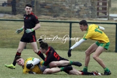 Aaron Neilan retains the ball against Tyrone in Magheragallon on Saturday.