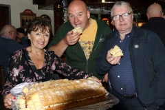 Cllr Michael Mac Giolla Easpuig and Eugene Sweeney sample some of Noreen Byrne's home baking at Feile Anagaire.