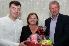 Siobhan Hunter and Packie Mc Hugh making a presentation to James Boyle (left) who officially opened the Maghery festival at the weekend. (Pictures by Eoin Mc Garvey)