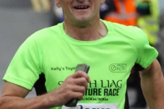 Robert Elliot crossing the finish line at the Dungloe 5k.