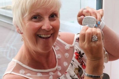 I found my name...Maire Mc Cole finds her name on the Mary from Dungloe winners medallion at the brochure launch in Dungloe on Tuesday night. Maire won the contest in 1983. (Photo by Eoin Mc Garvey)