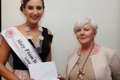 Mary Ward of the Mary from Dungloe Festival presenting a voucher from Mc Elhinneys to Roisin Maher, 2019 Mary from Dungloe winner.