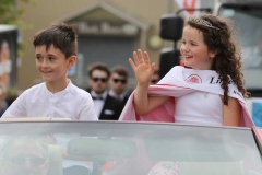 Little Miss Isabella Bulger and her escort James Doherty at the Mary from Dungloe parade.