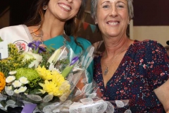 Festival chairperson Anthea Atkinson presenting flowers to the 2018 winner Caroline O'Donnell.