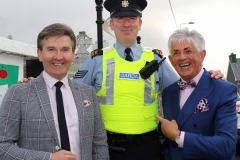 An arresting sight on Dungloe's main street as Garda Sergeant Rory Harrison meets up with Daniel O'Donnell and Noel Cunningham at the opening of the festival. (Photos by Eoin Mc Garvey)